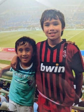 luca and his brother at a football game