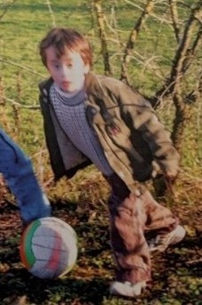 A child with a ball AI-generated content may be incorrect.